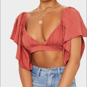 NWOT Prettylittlething flowy crop top coral/orange size 4 flared sleeves